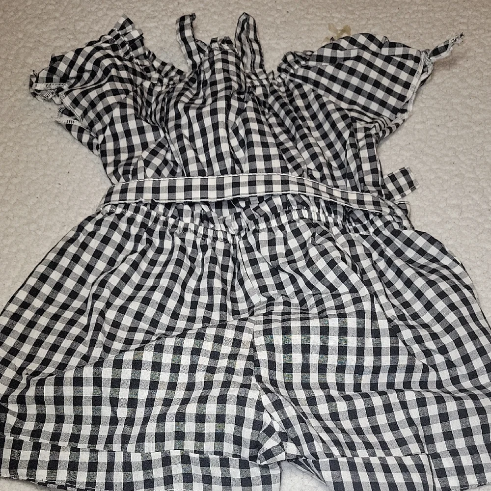 Charming Black and White Checkered Romper with Floral Detail - Picture 3 of 5